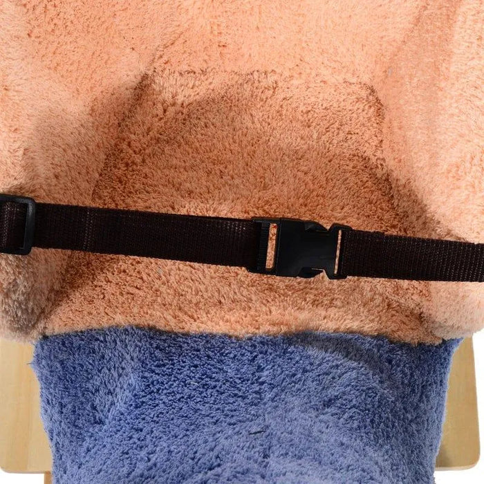 Close-up of blue plush elephant rocking horse seat with safety belt