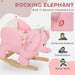 Pink rocking elephant toy with text highlighting features on a light pink background