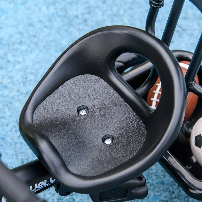 Close-up of a steering wheel with a textured grip on a blue background