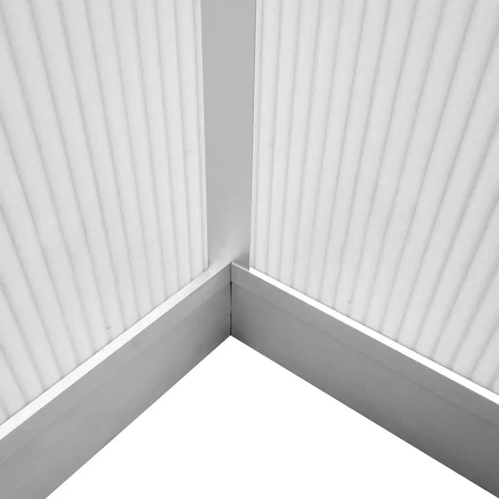Close-up of double-walled polycarbonate greenhouse corner with aluminum frame