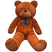 Brown teddy bear with a polka dot bow tie on a white background
