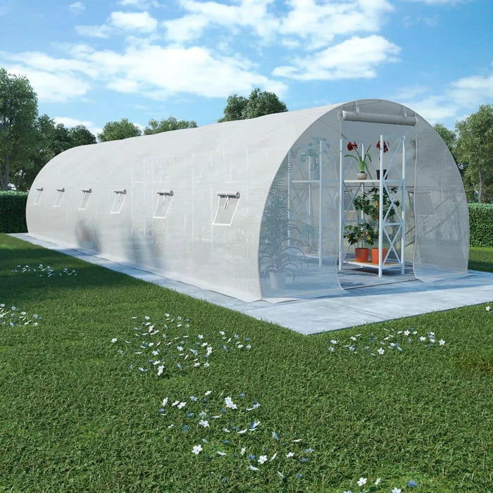 Extra-large walk-in polytunnel greenhouse with PE mesh cover in a garden setting
