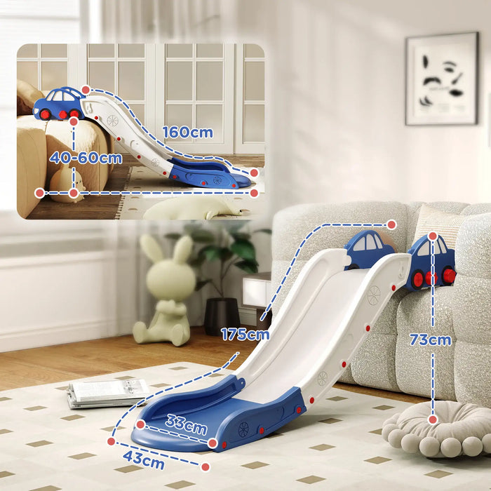 Blue and white kids indoor slide with car design, placed on carpet next to gray sofa, size dimensions shown