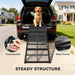 Dog using a pet ramp to enter an SUV with details on structure and materials.