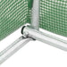 Metal greenhouse frame with green polytunnel mesh cover closeup