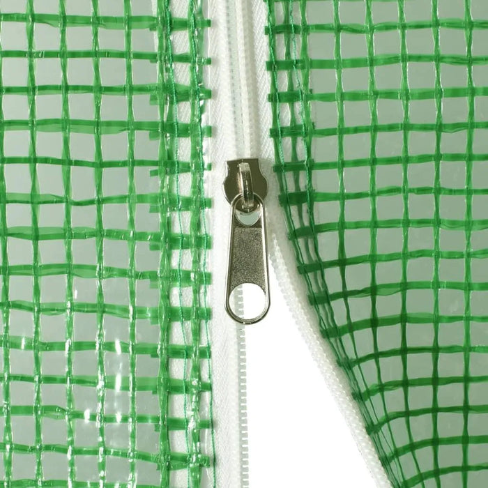 Close-up of green polytunnel greenhouse mesh cover with white zipper