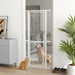 White metal pet gate installed in doorway separating dog in bedroom and cat outside in modern room