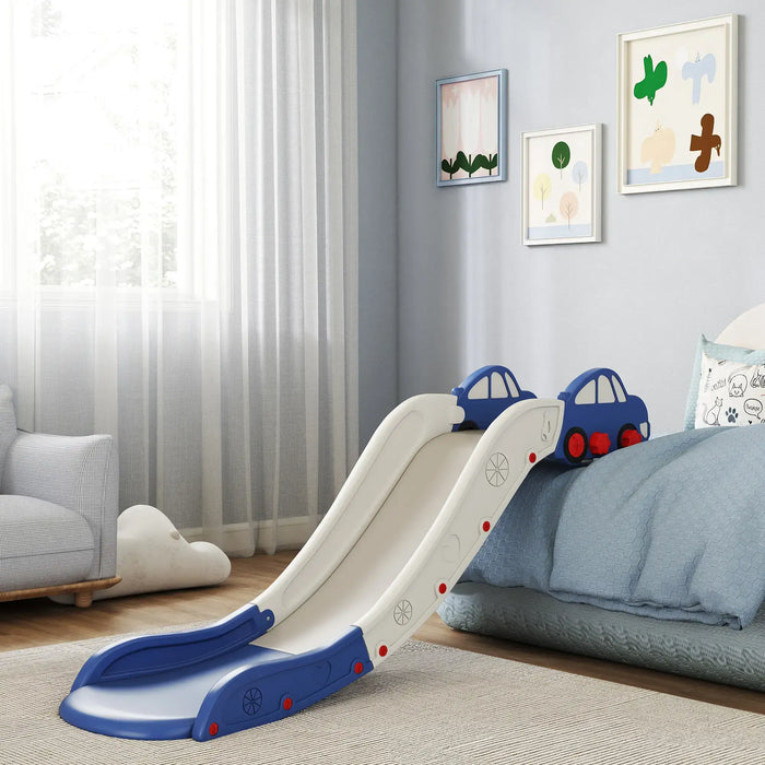 Blue and white indoor kids slide with car-shaped handles attached to a blue bed in a cozy bedroom