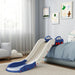 Blue and white indoor kids slide with car-shaped handles attached to a blue bed in a cozy bedroom