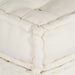 Close-up of a white comforter with visible stitching details.