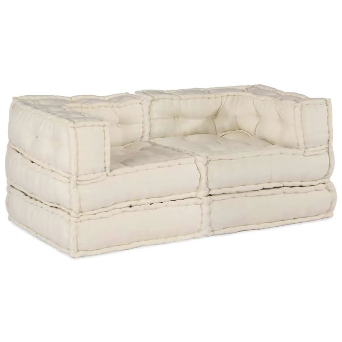 Beige tufted sofa on a white background