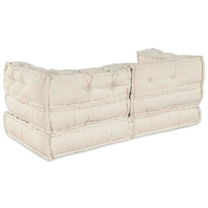 Beige quilted ottoman on a white background