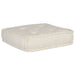 White quilted ottoman on a white background