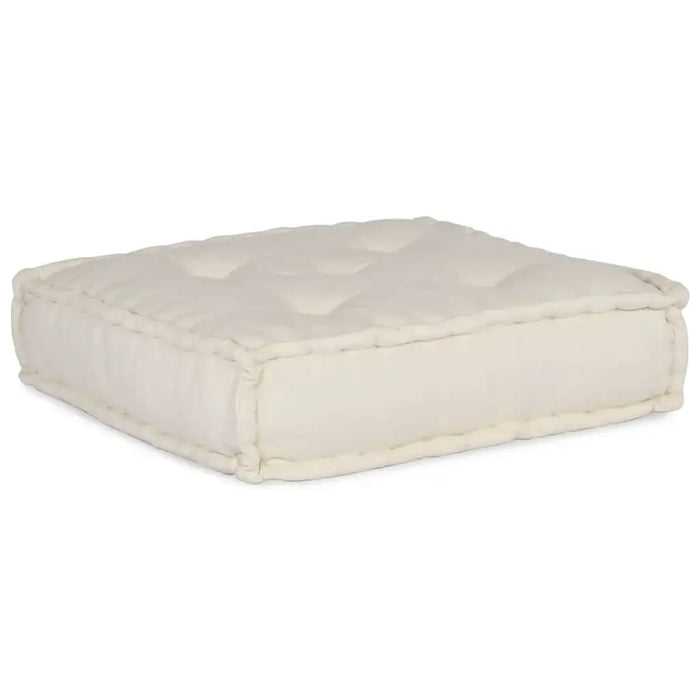 White quilted ottoman on a white background