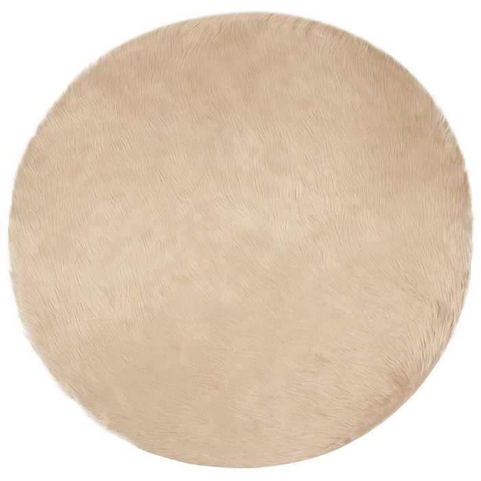 Round beige rug on a white background