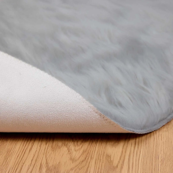 Gray rug on a wooden floor