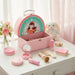 Set of children's beauty items including a pink suitcase, mirror, comb, and various cosmetic tools with measurements.