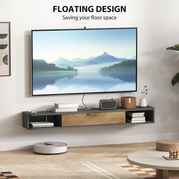 Floating black and wood TV cabinet mounted on wall with decor and cable management in modern living room