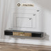 Floating TV cabinet in black and wood finish with storage compartments and cable management, wall-mounted