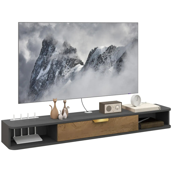 Modern floating TV cabinet in black and wood finish with cable management, decorative figurines, clock, and radio