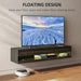 Black floating TV stand with LED lights and glass doors, holding a large flat screen TV showing a snowy landscape