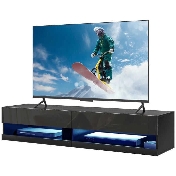 Black high gloss floating TV stand with LED lights holding a large flat-screen TV showing a snowboarding scene