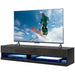 Black high gloss floating TV stand with LED lights holding a large flat-screen TV showing a snowboarding scene