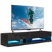 Black floating TV stand with LED lights holding a large flat-screen TV showing a snowboarder in action