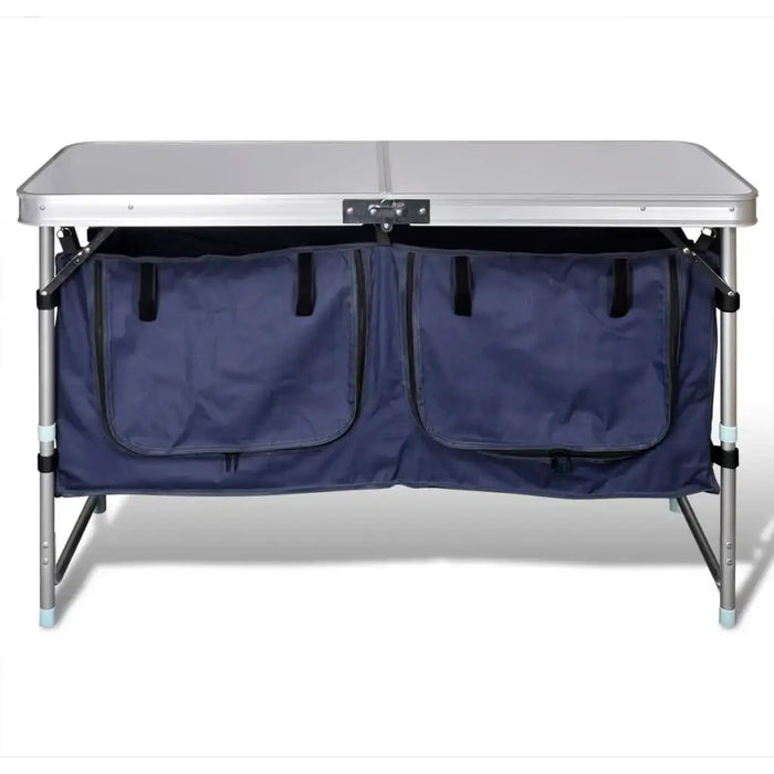 Foldable camping cupboard with two blue storage compartments and aluminum frame