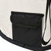 Close-up of black pocket on foldable dog playpen in cream and black fabric