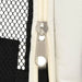 Close-up of a silver zipper on a black mesh and cream fabric foldable dog playpen