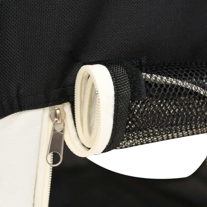 Close-up of foldable dog playpen black and cream zippered mesh window