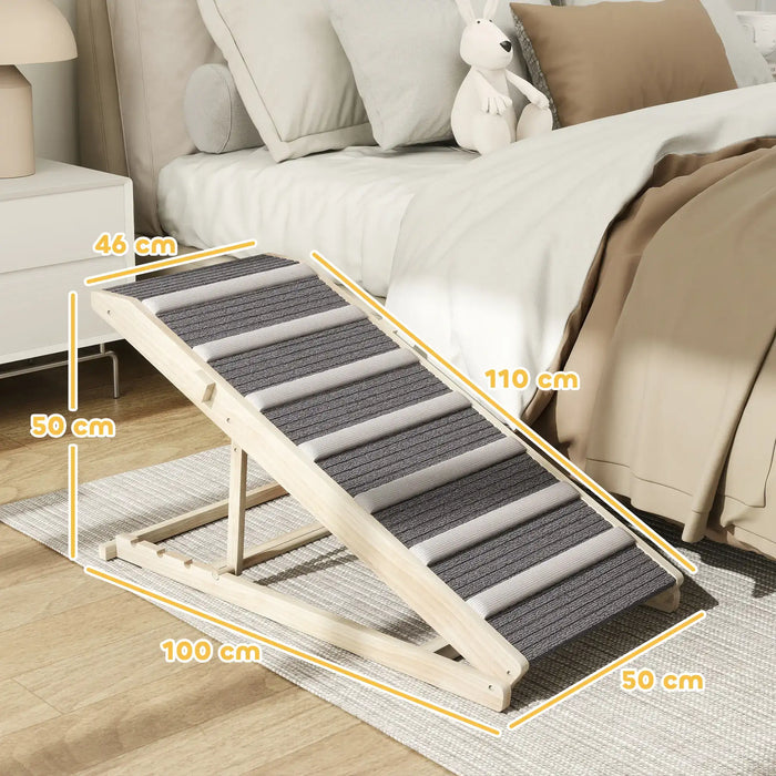Wooden pet ramp with gray carpet strips beside bed in bedroom, dimensions labeled