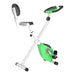 Green and white exercise bike on a white background