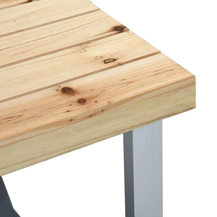 Close-up of wooden folding camping table corner with silver metal leg