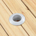 Round umbrella hole with silver ring in light wood camping table surface