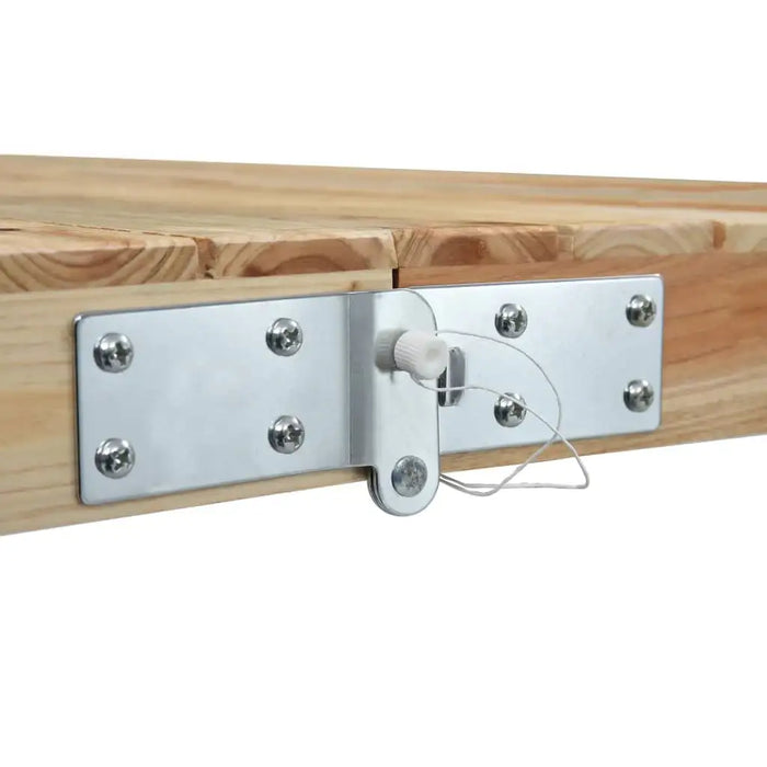 Close-up of folding wood table hinge with silver metal latch and visible screws