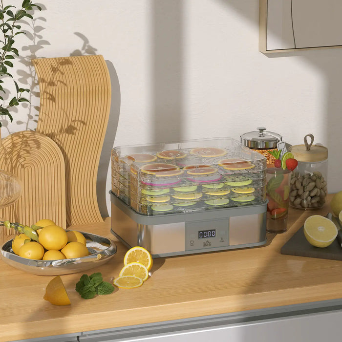 Food dehydrator on a kitchen counter with lemons and other items