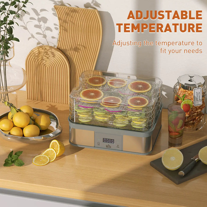 Fruit dehydrator on a wooden table with lemons and oranges, featuring adjustable temperature text.