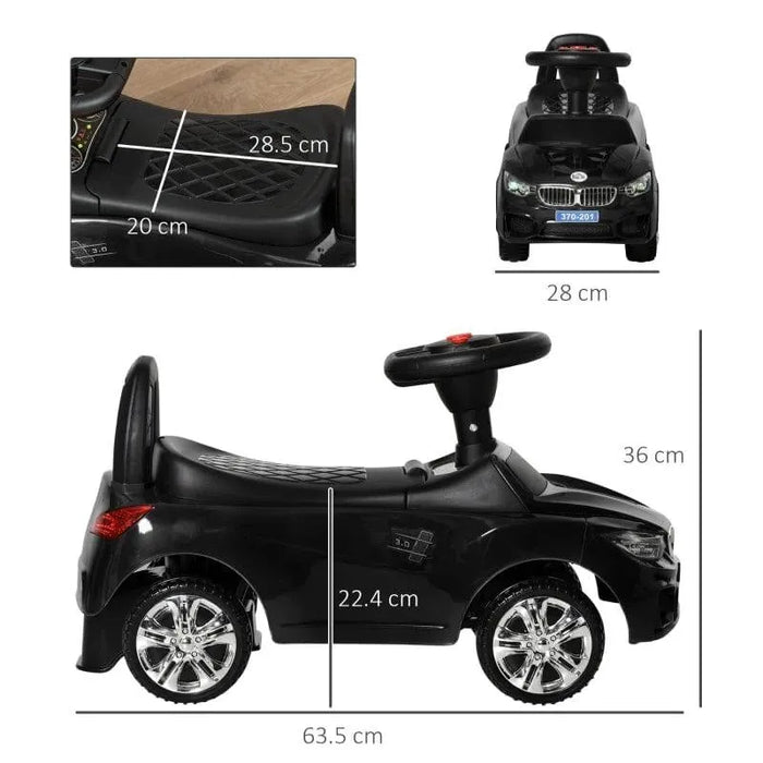 Black foot-to-floor ride-on car for toddlers with steering wheel, chrome wheels, and size dimensions.