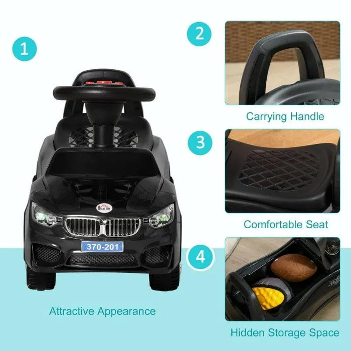 Black foot-to-floor ride-on car for toddlers with carrying handle, comfortable seat, and hidden storage.