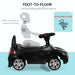Black foot-to-floor ride-on car for toddlers with steering wheel and shiny wheels.