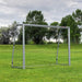 8ft x 5ft portable football goal net on green grass field with trees in background
