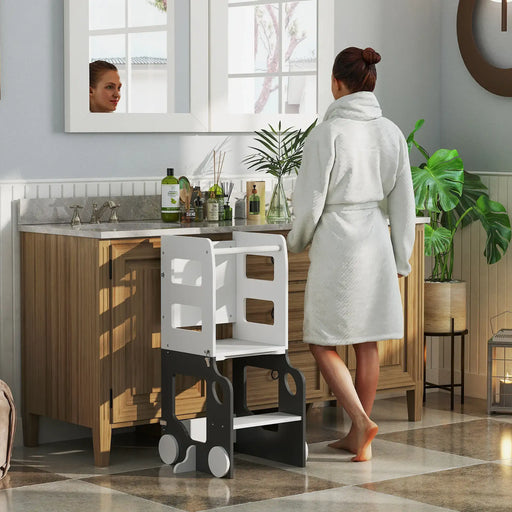 Woman in a bathrobe standing in a bathroom with a high chair.