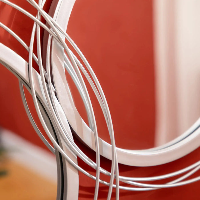 Close-up of white metal wires against a red background