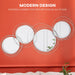Modern design elements on a red wall with circular mirrors and text about modern style.