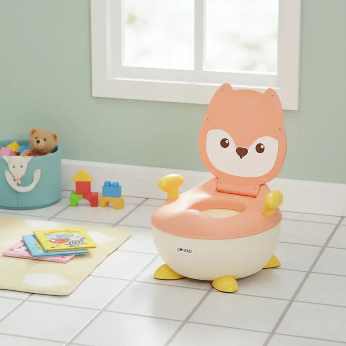 Children's potty chair with fox design on a tiled floor with toys in the background