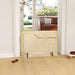 Beige radiator on a wooden floor with a living room in the background