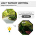 Light sensor control feature with daytime park path and nighttime illuminated street lamp by bench