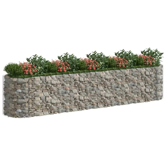 Gabion raised bed planter with galvanized iron mesh and rock fill, blooming pink flowers on top